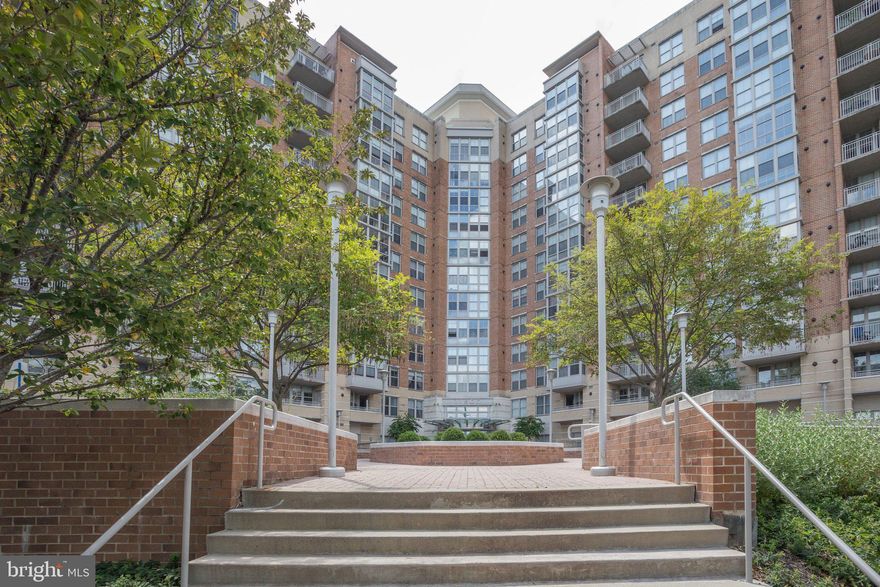 Welcome to elevated living at The Carlton House! Perfectly positioned just steps from Reston Town Center and offering the ideal blend of modern updates, everyday convenience, and vibrant urban lifestyle. This move-in ready 2 bed, 2 bath condo features a bright, open-concept floor plan enhanced with large windows and new LVP flooring (2024). The gourmet kitchen boasts granite countertops, tons of cabinetry, and stainless steel appliances. With seamless flow into the spacious living and dining areas this unit is perfect for entertaining and everyday living. The spacious sunroom is the perfect spot for your plant collection or a peaceful retreat to enjoy nature and skyline views without leaving the comfort of your home. The dual primary bedrooms offer privacy, flexibility, and benefits including renovated ensuite bathrooms and walk-in closets. Notable updates: hot water heater (2025), LVP flooring (2024), renovated hall bath (2024), HVAC (2021), modern light fixtures (2024), and kitchen faucet (2026). Residents of Carlton House enjoy resort-style amenities including a rooftop pool and terrace with grilling areas, fitness center, yoga room, theater room, business center, concierge service, and elegant club spaces perfect for entertaining. Two assigned underground garage parking spaces and storage unit convey. Direct access to the W&OD Trail invites outdoor recreation, while Reston Town Center’s dining, shopping, and entertainment are just 2 blocks away! Less than 2 miles from the Reston Metro station and various commuter routes (Route 7, 267, 286) make commuting effortless no matter where in the DMV you need to go.