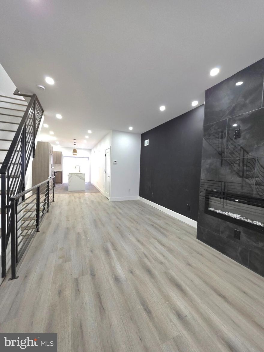 5349 Delancey St, Philadelphia, PA 19143. Welcome to this beautifully and professionally remodeled home designed for modern living. Step in from the front porch into a bright, open floor plan flooded with natural light and generous room proportions. The spacious, custom kitchen features all‑new stainless‑steel appliances — range, microwave, and dishwasher — and a large island that provides extra prep space and a casual spot for morning coffee. The kitchen is finished to your taste, with the opportunity to choose your countertop and backsplash to make the space your own. From the kitchen you’ll find access to a large deck, perfect for gardening, barbecues, or watching the sunset with family and friends.
This home offers 3 bedrooms and 3 full bathrooms, including a must‑see master en suite. The finished lower level adds flexible living space and includes the laundry area, making everyday living convenient. Every detail was considered during the renovation, from the flow of the open plan to the high‑quality finishes throughout. Don’t miss the chance to own a home where style and function meet.