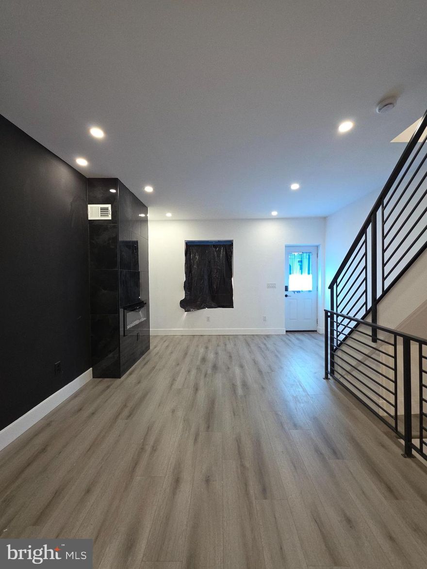 5349 Delancey St, Philadelphia, PA 19143. Welcome to this beautifully and professionally remodeled home designed for modern living. Step in from the front porch into a bright, open floor plan flooded with natural light and generous room proportions. The spacious, custom kitchen features all‑new stainless‑steel appliances — range, microwave, and dishwasher — and a large island that provides extra prep space and a casual spot for morning coffee. The kitchen is finished to your taste, with the opportunity to choose your countertop and backsplash to make the space your own. From the kitchen you’ll find access to a large deck, perfect for gardening, barbecues, or watching the sunset with family and friends.
This home offers 3 bedrooms and 3 full bathrooms, including a must‑see master en suite. The finished lower level adds flexible living space and includes the laundry area, making everyday living convenient. Every detail was considered during the renovation, from the flow of the open plan to the high‑quality finishes throughout. Don’t miss the chance to own a home where style and function meet.