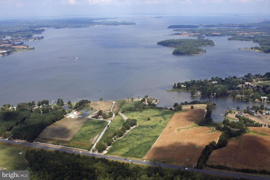 "Newcomb Hall Farm".  4 miles from St. Michaels and 5 miles from Easton. Private tree line driveway passing through productive fields. Mature evergreen and deciduous trees. Remarkable true point of land with panoramic views of Miles River (killer sunsets) and quiet views of cove and Newcomb Creek. Over 1500 ft shoreline, rip-rapped, bulkheaded and grassed as needed. Newish dock,well & septic
