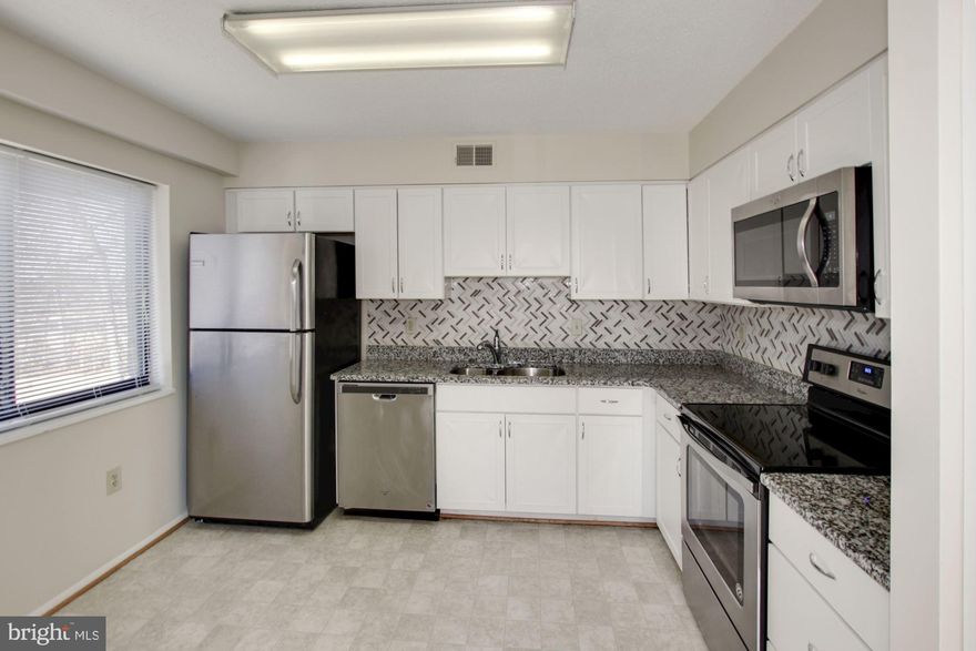 Wonderful roomy one bedroom with windows on two sides, including a great kitchen window with a nice view!  Washer and dryer in separate room- plenty of storage there as well.   Building is easily walkable to Clubhouse II, which has a fitness center, auditorium, indoor pool, ceramics studio, game room, tennis courts, and more!  Come and see for yourself!  Sold as-is, but unit is in great shape with new carpet and paint.