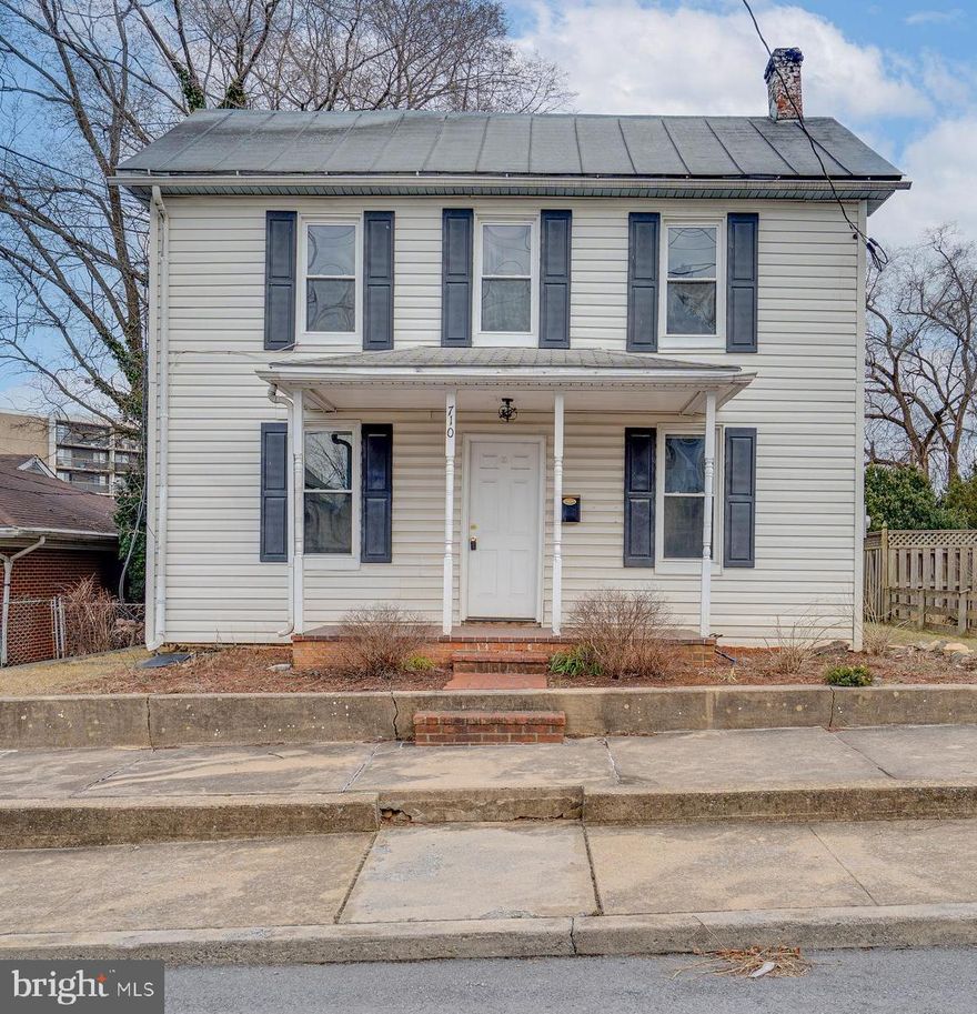 Well maintained affordable 3 bed 2 bath home with large backyard, hardwood floors throughout, 2nd level balcony, and large from porch. The kitchen is quipped with stainless steel appliances and a large pantry.  The dinning room  features a butlers pantry, wainscoting, crown molding, and an updated chandelier. The large family room is accented with wainscoting, crown molding, and has access to the backyard.  The upstairs features 3 nicely sized bedrooms all with hardwood floors and are equipped with built-in cabinets, a rear covered porch, and stairs to access the attic for additional storage. The full bathroom upstairs has a tub/shower combination. Heat is provided by oil and multiple window ac units convey along with the washer and dryer on the main level.  There is plenty of street parking and walking distance to multiple schools, and easy access to shopping and major commuting routes. Don't delay as this property is priced to sell.