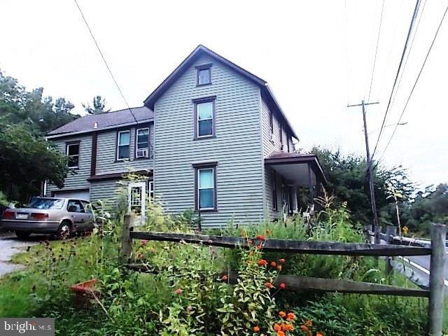 2016 is the time to gather family & friends to celebrate years to come in this 1900?s traditional farmhouse! Hardwood floors, formal dining, eat-in kitchen w/ bartop, (2) full baths leaves you wondering how could this be at this $? PLUS 2 acres of gardening rich soil & wooded backyard will surely be a pleaser for campfires & enjoyment. Outside city limits yet not too far out for all your conveniences! New electrical wiring 2/24/16! Call to make this HOME today!