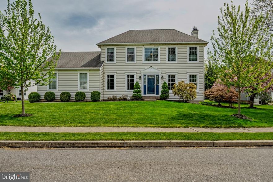 This distinguished two-story center hall Colonial, ideally situated in a quiet, child-friendly, tree-lined neighborhood within the rarely offered Oaks Estate section of Collegeville, blends timeless architecture with refined living. Offering three bedrooms, two full baths, a powder room, and a beautifully finished lower level, this home presents an exceptional opportunity in one of the area’s most desirable settings—complete with sidewalks, professionally maintained grounds, and no HOA fees.A gracious center hall entry sets the tone, complemented by rich hardwood flooring that extends throughout the entire first level. The main level is thoughtfully designed for both elegant entertaining and everyday comfort, featuring a spacious formal dining room enhanced by chair rail and crown molding. The chef’s kitchen has been fully reimagined and exquisitely remodeled, showcasing gas cooking with a slide-in range, a beautifully positioned corner sink framed by windows that fill the space with natural light, ceiling-height cabinetry, an elegant gray subway tile backsplash, a center island with seating, and a separate breakfast bar—creating multiple areas for gathering and casual dining.Flowing seamlessly from the kitchen is a generous family room filled with windows, offering an abundance of natural light and an inviting atmosphere. A versatile living room, currently used as a private and spacious home office, provides flexibility for today’s evolving lifestyle. Completing the main level are a discreetly placed powder room and an enormous laundry/mudroom, thoughtfully designed for everyday convenience.Upstairs, enter through double doors into the serene primary suite, featuring a tray ceiling with fan, bedside wall sconces, and a walk-in closet with custom shelving. The luxurious en-suite bath offers a beautifully updated shower with elegant tile work and frameless glass door, a large corner soaking tub, and a double vanity. Two additional generously sized bedrooms also feature custom closet systems, including one with a walk-in closet, and are serviced by a well-appointed hall bath.The finished lower level, approximately 700 square feet, adds exceptional versatility with a separate room currently utilized as a fourth bedroom, along with an expansive open area ideal for a game room, media space, or flexible living, plus additional storage.Outdoor living is equally impressive, with a maintenance-free TimberTech deck complete with lighting and a motorized awning—perfect for relaxing or entertaining on sunny days.The location is truly unmatched—just minutes from Valley Forge National Historical Park and only five minutes to the vibrant downtown of Phoenixville, recently named “#1 Best Small Town to Live In” by Travel + Leisure in August 2025. Situated within the award-winning Spring-Ford Area School District, and offering convenient access to King of Prussia Mall, Providence Town Center, major routes including 422, 29, 113, 202, and the PA Turnpike, as well as employers such as GlaxoSmithKline and Pfizer, this home delivers both lifestyle and convenience.With low real estate taxes, no HOA fees, and a premier location surrounded by shopping, dining, parks, and major commuting routes, this exceptional residence offers the perfect balance of luxury, comfort, and practicality. Welcome home.