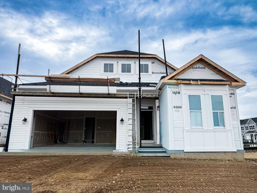 Brand New Matisse is under construction and will be ready soon at Hiatt Pointe at Snowden Bridge, a community for those 55 or better! 
The thoughtfully designed gourmet kitchen is outfitted with premium KitchenAid appliances, an extended island, a spacious walk-in pantry and Carrara Mist quartz countertops. Flowing seamlessly from the kitchen is the bright dining area and family room, all under soaring 10' ceilings, creating an airy and inviting atmosphere. The rear of the home also features a completely screened in porch, ideal for morning coffee or evening conversations.
Relax in the spacious and luxurious primary suite with a rear extension. Then leading from the bedroom there are with two large walk in closets and an en suite bathroom featuring a frameless shower door and dual vanities with quartz countertops. On the opposite side of the home there are two additional bedrooms providing flexibility and privacy for guests or the perfect quiet space for a home office.
The finished lower level adds incredible value and functionality with a spacious recreation room, a fourth bedroom, and a full bathroom. There is a lower level exit to the backyard which allows for easy access to outdoor spaces and natural light throughout the lower level.
Community will offer a gated entrance, bocce & pickleball courts, clubhouse with event room, fitness and yoga studio, outdoor kitchen with gas grill and an outdoor pool with hot tub. Snow, trash and recycling included. 
ASK ABOUT SPECIAL FINANCING AND CLOSING COSTS!
Please note interior photos are for floorplan reference only and not of the actual home as it is still under construction.