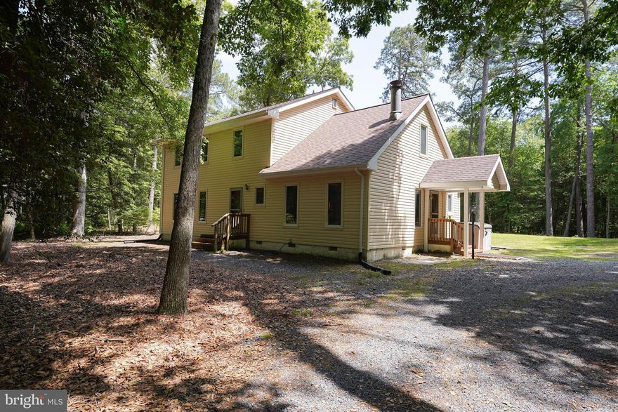 Welcome home to 31677 Hideaway Drive! Nestled on just over 3 acres, this 4 bedroom 2.5 bath home offers a country like setting while being only a few minutes away from shopping, restaurants, entertainment, and more. Downstairs, a living room, kitchen, large family room, formal dining room, half bath, and laundry room make in convenient for gatherings while upstairs hosts the bedrooms and 2 full bathrooms. Outside surrounded by beautiful mature trees or relaxing on the screen porch, you can enjoy everything that nature brings. With room to garden, play, or just relax, this could be your own little paradise. Many upgrades have been made to the property in the past 5 years including but not limited to, a new septic in 2018, new roof in May 2023, HVAC, encapsulated crawl space, and more! Definitely a home worth seeing!