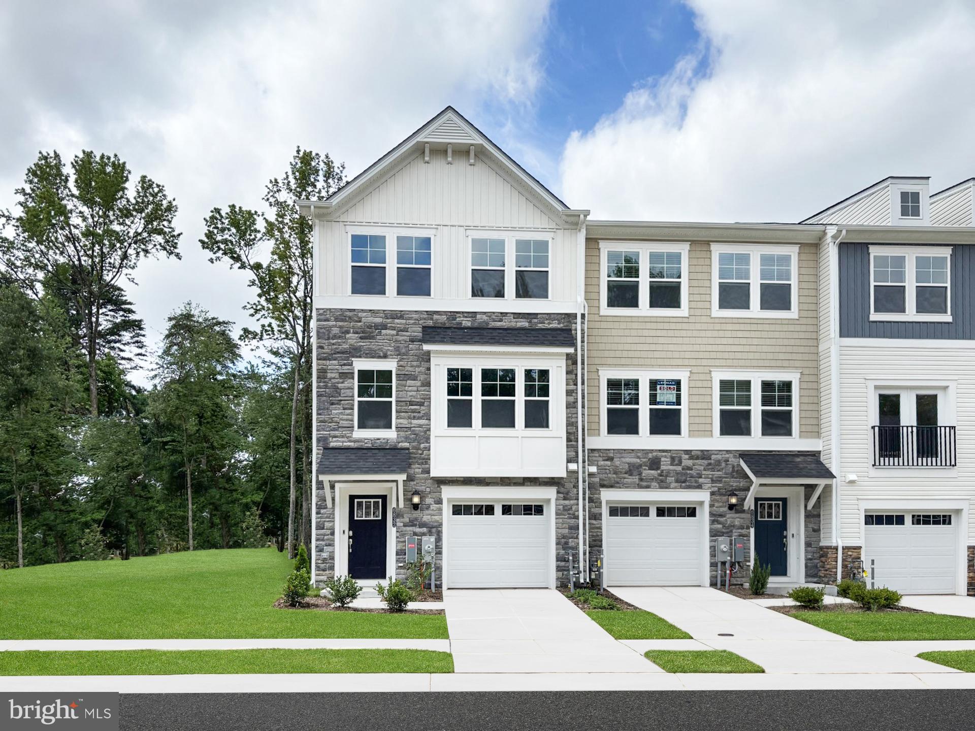 This luxury townhome backs to trees! 3 bedrooms, 3.5 baths and garage. End unit home offering plenty of natural lighting. Finished walkout lower level, great for entertaining. Welcome to your dream home! A brand new, modern crafted Townhome where luxury meets natural tranquility backing to trees. This beautiful open design has plenty of natural light with high end finishes throughout. The kitchen includes stainless appliances and a 10 foot granite counter Island - perfect for entertaining. The spacious living and dining areas flow seamlessly to a private deck. Upstairs, the primary suite is a luxurious escape with a large master bath and walk-in closet. Additional bedrooms offer space for family, guests, or a home office. Resort-Style amenities including a Clubhouse, fitness center, large pool with space for family fun! A private marina perfect for waterfront enjoyment, dog park, playgrounds and walking trails. Photos are for illustration purposes only. Photos are for illustration purposes. Agents must accompany buyer during first visit to the community.