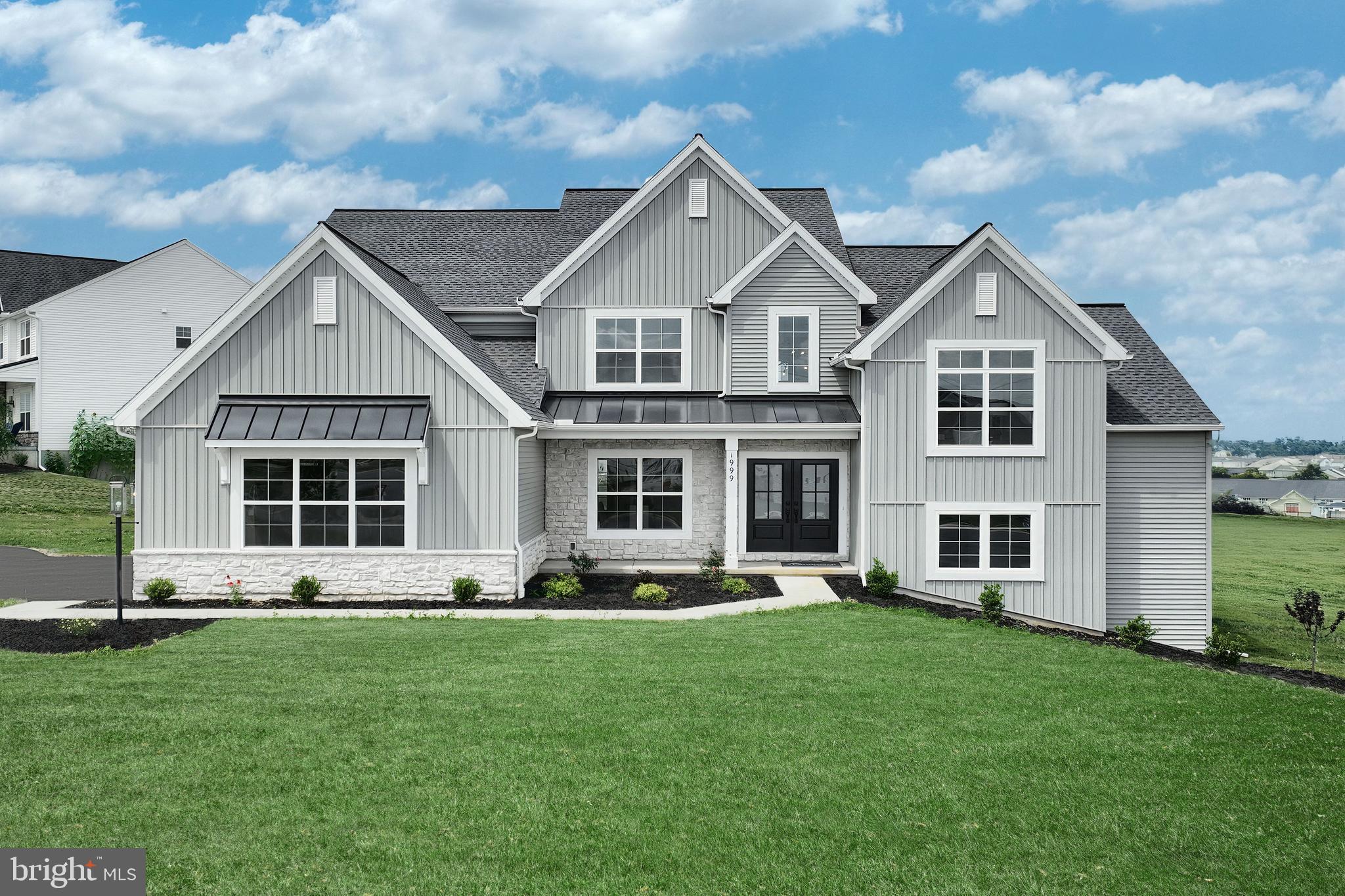 Designer details abound in this contemporary 2-story home featuring a 3-car, side-load garage with mudroom entry and laundry room access. A dramatic 2-story ceiling creates a grand first impression in the foyer, where elegant vinyl plank flooring extends throughout the main living areas. Just beyond the foyer and formal dining room with a beautiful accent wall, the 2-story great room is warmed by a gas fireplace with a tile surround and solid wood slats that create the perfect focal point. The kitchen is well appointed with enhanced appliances and cabinetry, quartz countertops with a tile backsplash, and two large islands. Off the kitchen is a sunny breakfast area that provides access to a rear, composite deck. The home also boasts a spacious loft, a finished lower-level bonus room, and a private study with a vaulted ceiling. The first-floor owner’s suite accented by a tray ceiling includes a private bathroom with a tile shower, double bowl vanity, freestanding tub, and an expansive closet. Three bedrooms with large closets and two full baths are located on the second floor.