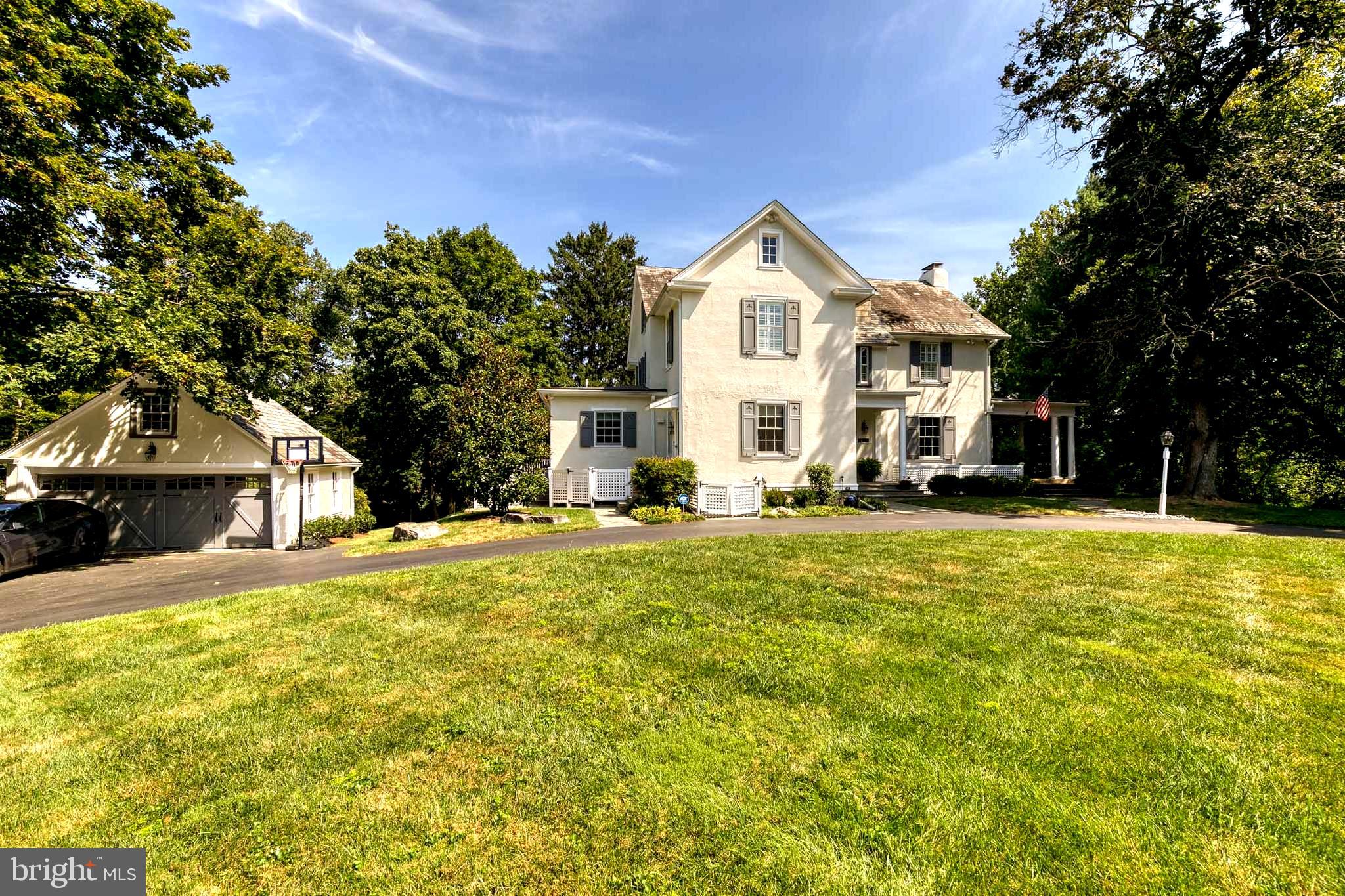Magnificent Ruxton gem, recently and expertly renovated by Case Builders, but maintaining the old-world charm. This gorgeous sun-drenched home in the heart of Ruxton has it all! Stunning, renovated kitchen with Honed Carrara marble countertops, stainless steel appliances, WOLF stove, expansive island with sink, coffee bar, detailed backsplash, sidebar with additional sink, multiple dishwashers, fridge/freezer drawers, mud area with built-in cubbies, separate back stairwell leading to the second level, and sliding glass doors leading to the deck. As you continue through the first level, you enter the living room with beautiful built-ins, hardwood flooring, a wood-burning fireplace, overhead lighting, and incredible floor-to-ceiling French Doors leading out to the inviting covered side porch. The first level also has an enchanting dining room with a majestic mural, a warm family room with built-ins and wood flooring, and a charming powder room. As you head up the grand staircase to the second level, there is an open hall office space/sitting area with built-ins, 4 large, beautiful bedrooms, 2 baths, and upstairs laundry. The primary bedroom and bath have been meticulously renovated by Case Builders, with a private toilet, double sinks, built-in storage, heated floors, and an expansive standing shower. Travel up to the third level to two additional, generously sized bedrooms and a center full bath. As you step outside to the manicured grounds, you can relax on the deck that runs along the length of the home, or the beautiful, covered porch. The front and rear yards are both expansive, with a recent fence in the back, an invisible fence in the front, and a circular driveway as well as a two-car garage with a Tesla charger and additional room/storage above the garage. This is a must-see home.