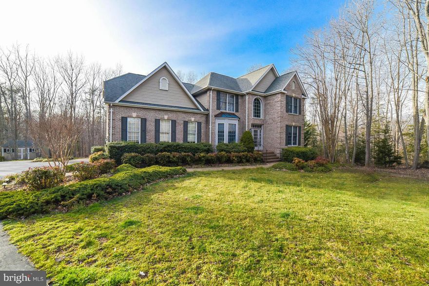 Gorgeous custom home in Avenmar w/ a wonderful walkout basement, including pool table, home theater & wet bar; perfect for entertaining. Rear deck looking out on beautiful wooded lot, hot tub adjoining 200 sqft slate patio.Granite counters & upgraded appliances. Inground sprinkler system, new well pump installed, newer high efficiency water heater w/ newer heatpumps. Home warranty & mower conveys.