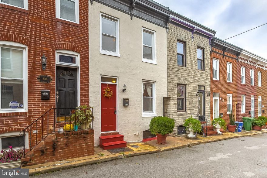 City living at it's finest! Why rent when you can own this Fells Point gem just one block off of Patterson Park?! Nestled on a quiet alley-street, S Madeira will charm you! Beautifully maintained hardwood floors throughout. Galley kitchen with granite counter tops and ample storage. Adorable private back patio, awaiting your finishing touches. Upstairs has a great bedroom to bathroom ratio with a master bed plus en suite bath and second bath and second bedroom in rear.  New AC and furnace in 2019 with warranty until 2029 that will transfer to new buyer. Freshly painted exterior in 2019. Water proofing system installed in 2019. A short walk away from Patterson Park (1 block) and all that Fells Point, Butcher's Hill and Canton has to offer. and A fantastic deal that will not last long in this market!