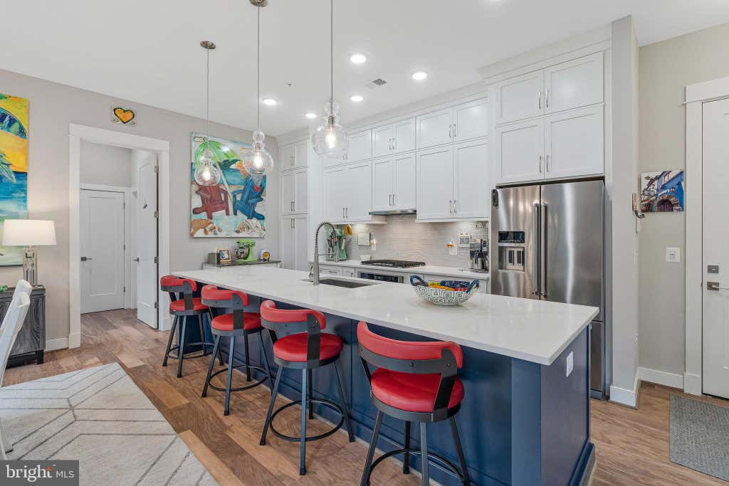 Photo of 3 Stationmaster Street SE #201, LEESBURG, VA 20175 (MLS # VALO2133328)