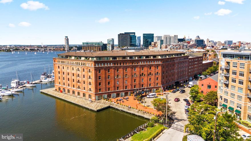 Nestled at the end of picturesque cobblestone streets in historic Fells Point, this spacious condo is located in Henderson’s Wharf—the premier luxury waterfront building in the area. Offering an unparalleled blend of charm, history, and modern convenience, this one-level home is perfect for both entertaining and everyday living.
Inside, you’ll find an open-concept floor plan with abundant storage, a bright kitchen featuring stainless steel appliances, subway tile backsplash, open shelving, and a pass-through to the dining area for effortless hosting. The serene second-floor setting overlooks a private tree-lined courtyard, bathing the unit in natural light while providing a peaceful retreat.
Additional highlights include: In-unit laundry with stackable washer & dryer, Updated flooring throughout, Two separate heating/cooling zones with individual thermostats, Owner-owned indoor parking
Henderson’s Wharf offers an impressive array of amenities: a 24-hour gym, modern lobby and guest lounge, full-service front desk with package concierge, secure entry, bike storage, and continuous building updates that reflect its high standards.
Step outside your door to enjoy waterfront biking, running, and walking paths—or explore Fells Point’s renowned dining, shopping, and nightlife. With close proximity to major hospitals and new retail centers, this location balances convenience with lifestyle.
Mortgage savings may be available for buyers of this listing.