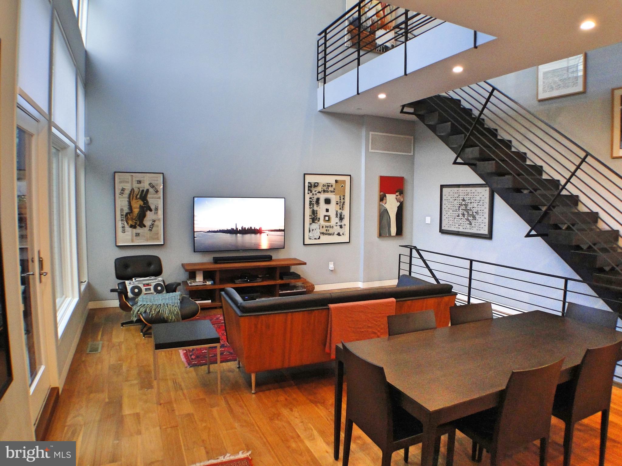 Stunning, 32' wide custom home with 2-car garage parking, 3 outdoor spaces, superior quality construction and finishes, with all the features, upgrades and tech you have been seeking. No detail was spared when creating this impressive home, spanning 5 levels with 3 bedrooms, 4 full bathrooms, a bonus flex space and huge finished basement. Located on a quiet side street in a prime Graduate Hospital location, the unique facade will first draw you in, featuring oversized black brick, architectural block, heat treated poplar & Hardy cement board. Entering from the foyer (with coat closet), you'll be swept away by the dramatic main living area with soaring 20'+ ceilings with a massive wall of windows, open to the private side patio, letting the natural light flood in and creating a breathtaking space. The 1st level open floor plan flows from the oversized living area with access to the patio, to the dining space, followed by the kitchen in the front. The custom Porcelanosa kitchen is one of a kind with Krion seamless countertops, Miele & Thermador integrated appliances with induction range & double convection oven, breakfast bar seating and plenty of storage and counter space. All kitchen & bath hardware is the high end of Grohe, Duravit or Geberit. Throughout the home are soaring 10' ceilings, beautiful 6" wide plank solid walnut floors (finished on-site), custom steel/wood floating stairs with continuous railings from basement to roof. Some other noteworthy features include a 3 zone, high efficiency Lennox HVAC w/ humidifier; hydronic radiant floors in the basement, master bath & patio (snow melt system); on-demand water heater, LED lights throughout, closed cell foam insulation, wired for motorized blinds and so much more. Entertaining is a delight with various spaces to host your guests such as the spacious main level, the enormous basement, or one of the 3 outdoor spaces that provide approximately 600 sq ft of outdoor living space, with East, West & North exposures. The finished basement is massive, fully covering the 32'x32' lot & offers endless use options for living, entertaining & storage space. Currently set up with a custom home theater, oversized wet bar with bar seating, full bathroom, storage area & game area. The 2nd level encompasses the master suite & a dramatic hallway overlooking the wall of windows, patio & living area. The master bedroom is spacious with a walk in closet with custom organizers & oversized windows. The spa-like master bath boasts a floating double vanity w/ integrated sinks & wall-mount faucets, dual rainshower plus body-sprays & Jacuzzi tub. The 3rd level has 2 bedrooms, 2 bathrooms, laundry room plus a bonus flex space with access to the deck. One bedroom has an en suite bath & the other full bath is in the hall. The bonus area could serve many uses, an office, a sitting or reading area: utilizing the indoor/outdoor space from the 3rd floor deck. The last level is the penthouse with the 2nd wet bar,extra living/storage space & access to the large roof deck with breathtaking skyline views and IPE wood decking. Enjoy easy living with a gas line for the grill, custom planters with irrigation system & low maintenance green roof. The home boasts so many upgraded features we can't list them all, but some include the custom home theater with Sony 4K projector & 110' screen w/ Dynaudio speakers for 7.1 Dolby Atmos surround sound. Every room has ceiling speakers, 12 lighting zones utilizing Lutron Smart Bridge Pro (voice/app accessible), home automation system controlled w/wall mounted iPad, 2 Nest thermostats, 8 zone Nest Protect (Fire/CO2/nightlight), Chamberlin MyQ garage door opener to remotely control, security system w/ 2 exterior cameras & so much more. *See attached features list for more.* Located only 2 blocks from Avenue of the Arts a short walk to Rittenhouse and all the other great parts of the city, this home is not to be missed. Approximately 7 years remains on the tax abatement.