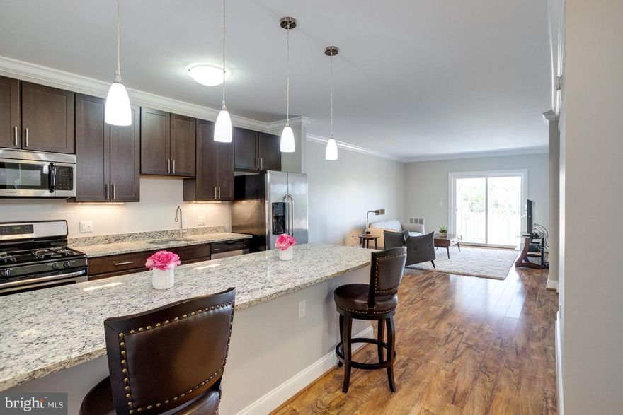 Welcome home to one of the larger units in this community!  It comes with 2 PARKING spaces, and 2 STORAGE units!! This newly painted 867 square feet, 1 bedroom, 1 bath condo features granite counter tops, hardwood floors and is perfect to entertain with it's naturally bright and spacious open floor plan with private balcony.  The gourmet kitchen has a Granite counter topped peninsula, stainless steel appliances with brand new dishwasher and brand new Microwave!  Relax in the large master bedroom with a tray ceiling, with new ceiling fan, and custom large walk in closet. Don't forget to enjoy your morning coffee on your private balcony. There's a cute table/nook area  across from your hall mirrored closet situated next to the large front-load stackable washer/dryer.  Let's not forget about all the amenities at The Isabella at Monticello Mews: upscale building, fitness center, community room, concierge services, outdoor swimming pool, gas grills, dog park, multi-purpose sports court and membership to Bren Mar Recreation Association, and metro shuttle to Van Dorn Metro during am/pm rush hour . Minutes to I-495, I-395, restaurants, shopping and more.