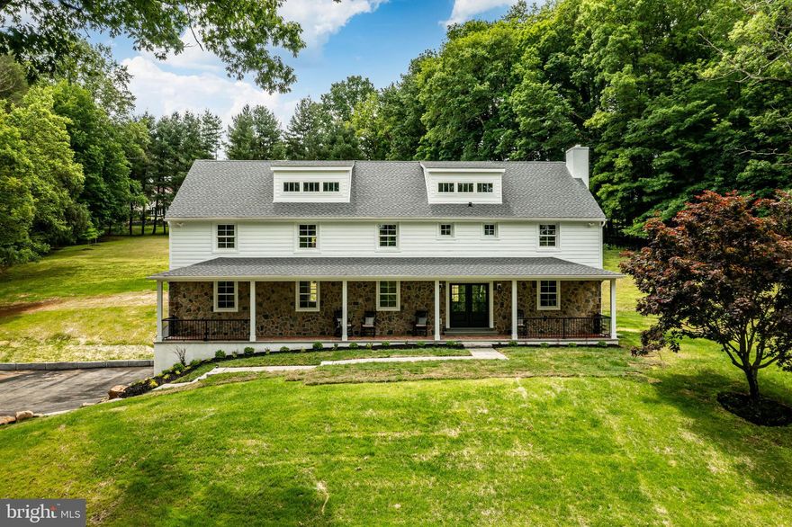 Welcome to this completely re-imagined modern Pennsylvania farmhouse, thoughtfully updated to cater to the most discriminating buyer while still preserving timeless charm. Rudloff Custom Builders, a premier custom builder renowned for his impeccable construction and state of the art designs, has turned this home into a  masterpiece! Boasting over 4528sq. ft. of living space, this home sits majestically on approx. 2.6 acres.
As you step onto the expansive, covered  front porch, an idyllic spot to savor breathtaking sunsets, you will enter through elegant double doors into a spacious foyer adorned with custom wainscoting, setting the tone for the exceptional craftsmanship throughout. This home features gleaming hardwood floors on both the first and second levels.  The formal living room offers a cozy ambiance with a gas fireplace, while the private first floor office boasts built-in shelving and glass doors for privacy, perfect for remote work or study. 
The heart of this home is absolutely the magnificent kitchen, designed for both beauty and function.  Custom cabinetry, many with glass front doors and gold touches, gleaming Quartz countertops, custom range hood over a 6-burner professional grade ZLINE gas range and a 9-foot center island with built in microwave that can comfortably seat five.  A Miele dishwasher, Bosch French door refrigerator, oversized sink with double windows that look out to the spacious back yard complete this culinary haven. 
Adjacent to the open kitchen, the great room impresses with its coffered ceiling, recessed lighting and six large windows with deep windowsills that flood the space with natural light.  There is ample room for both a large family room recreation area and for a 10-foot farmhouse table, making it an ideal setting for large gatherings.
The second floor offers a magnificent primary bedroom suite complete with cathedral ceiling, recessed lighting and large windows with deep windowsills.  His and her walk-in closet has been crafted with built in organizers and natural light.  The primary bath also has a cathedral ceiling, double sink vanity, and a custom tile shower that you have to see to believe!  The second bedroom has an attached bath with tile shower, tile floor and a Quartz top vanity.  Bedrooms 3 and 4 are spacious retreats with ample closets, hardwood floors and shared, well-appointed bathroom with tile floor, tub with tile surround, and a linen closet.  The spacious laundry room, conveniently located on the second floor, has custom built-in cabinetry,  a pocket door and a hook up for electric dryer.
There is a huge unfinished 3rd floor with dormers adding natural light and unique character, combined with an amazing view, just waiting for your finishing touches.  With over 650 square feet, there is plenty of room to create a functional area, perfect for an Au Pair Suite, private office, creative studio or a large bedroom.  The uses are only limited by one’s imagination.
The two car-attached garage offers a convenient entrance to the full, finished basement and mud room with built-ins.   There is also a large, stone private back patio, accessed by a glass panel door from the back foyer.  The spacious rear yard is perfect for any and all sporting activities.  All new Anderson high-performance windows and two separate HVAC systems, make for a very efficient home.  This home is not just a residence, it’s a masterpiece of design and craftsmanship, offering the ultimate of luxury living in the heart Chester County.  
Convenient to the vibrant Boro of West Chester, with it’s many top notch restaurants, shops and community functions, this home sits in a completely private setting.