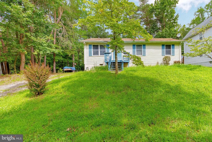 3 bed 1 Bath Rambler in the Chesapeake Ranch Estates! This home is off a one way street and is back to trees to separate from the main road. This home would be great for those looking to create some sweat equity! The back deck was modified to be handicap accessible. The backyard was once home to a spacious garden that is ready for a new owner. Become a CRE resident to gain access to the awesome beaches and have great proximity to all Lusby shopping and Solomon's Island dining! With alittle TLC this home could is a great investment at an entry level price point!