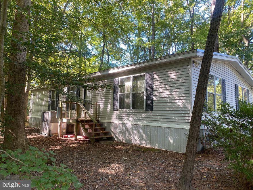 Well maintained 2003 2BR , 2 BA mobile home for sale in Wilson Landing. Roof and HVAC was replaced in 2022. Master bathroom was also remodeled with a stand up shower. The living room flows into the large, welcoming kitchen that offers abundant cabinet space and plenty of countertop space. Next to the kitchen, you will find the conveniently placed laundry room with a side door to the enclosed patio area. The dining room is adjoining to the kitchen and flowing openly to the spacious living room. $400 ground rent and covers trash also.   Sewer and Water are separately metered.   Sale will be contingent on approval by the park management.