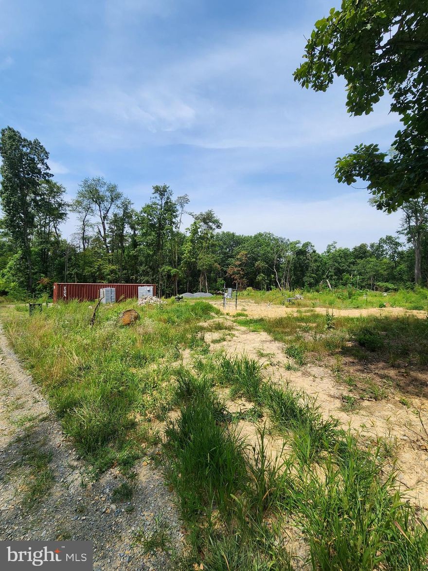 Incredible building lot in Parks Hollow subdivision. Six and a half acres with conventional septic system  installed & approved, well is dug and 200amp underground electric service is on site & turned on. Ready & waiting on you to build on NOW!