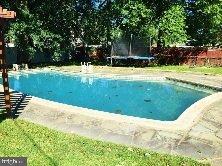 Brick colonial on a quiet street with garage!  Nice big back yard, screened back porch and an In-ground swimming pool.  Inside wood floors, living room with wood burning fireplace, separate dinning room with built in china cabinets, large bedrooms, and partially finished basement with a second full bath. Needs work! No FHA or VA financing. Check out pictures and make your appointment today!