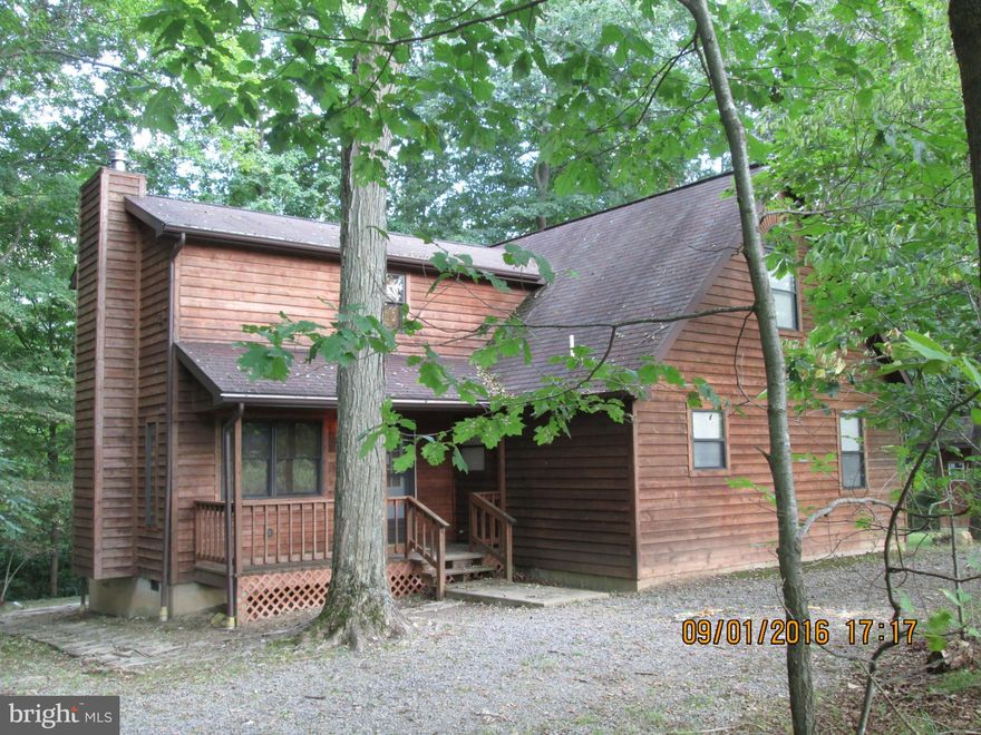 FM First Look Initiative for Owner occupants ends 9/22/16.Cedar sided contemporary home on 2 wooded acres in Cacapon River access community. Spacious home features main level BR, large living room with fireplace, family room with woodstove, large rear deck. Very private setting yet just minutes from historic Berkeley Springs.