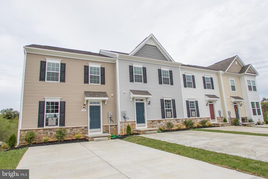 Brand new Archer II 3 Level  town with main level entrance to family room and kitchen!  Awesome all over with new wider floor plan - from the upgraded island kitchen with stainless appliances and gas range to the fully finished lower level rec to rooms and walk out to the yard. Maintenance free yard covered by HOA! Must see community! Don't miss out! End unit for added privacy and luxury finishes added throughout all 3 levels!