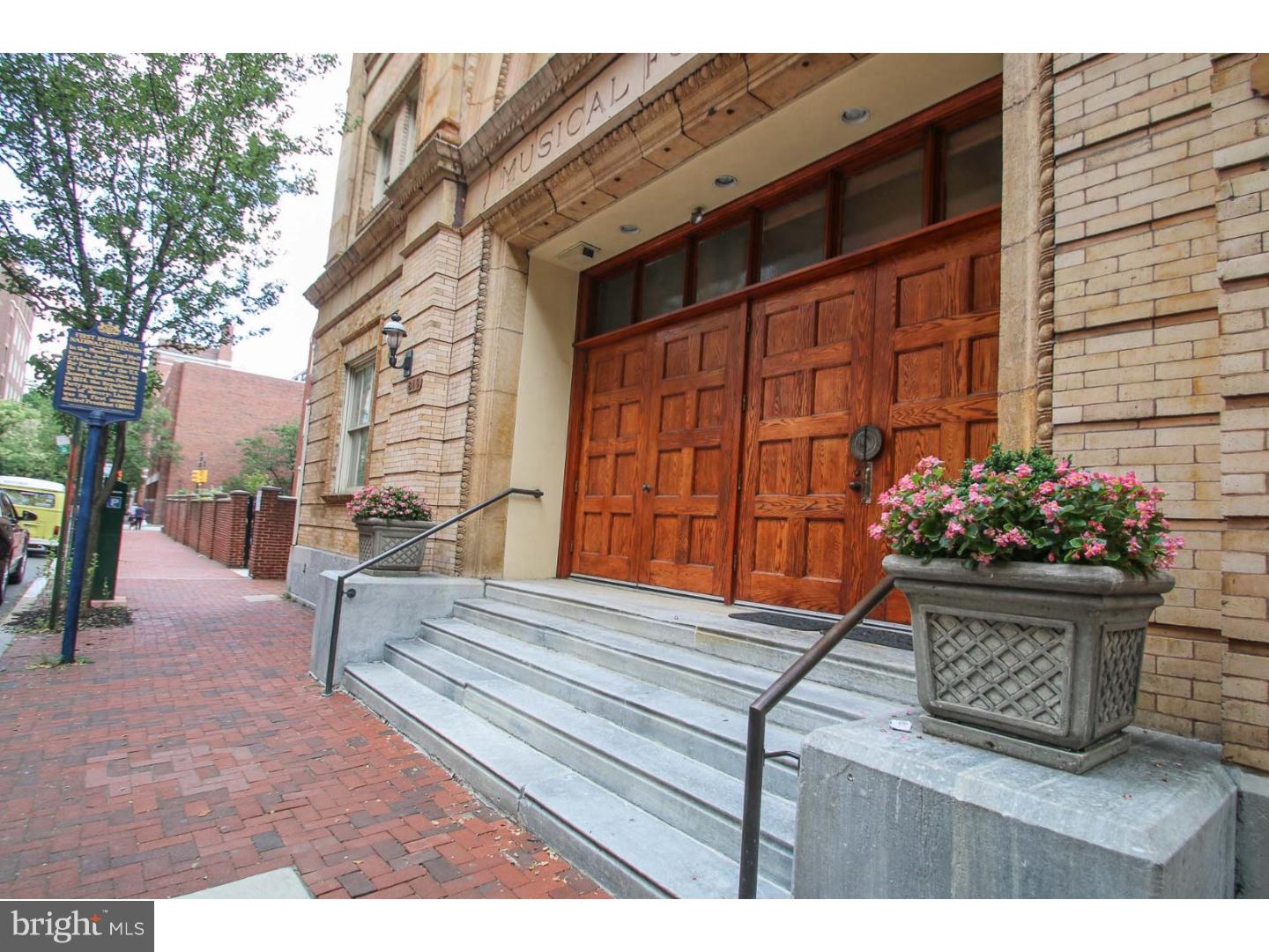 Magnificent condo in prestigious MUSICAL FUND HALL and is on the PHILADELPHIA HISTORIC LANDMARK registry, having been the site of the 1st Republican Party convention! This 1st floor, exceptional property, with foyer entrance, features dramatic 12 1/2 ft. dropped ceiling in great room and kitchen, with hidden accent cove lighting; eco-friendly (and beautiful) bamboo flooring through out; breathtaking floor-to-ceiling fireplace, with gorgeous, hone-finished stone facing; great sunlight exposure from the 9' x 5' windows in kitchen/great room, with electric shades, operated by Lutron remote control and main level lighting is on Lutron dimmers! The thoughtfully designed, updated kitchen features matte-finish 42" cherry wood cabinets; huge island with seating; high-level granite countertops; stainless appliances; tumbled marble backsplash; under-counter wine cooler and microwave; gooseneck faucet; deep stainless steel sink and high-end pendant lighting! The condo has a rarely-offered, brick patio, adding dramatic living space, with access from lower level bedrooms via sliders with wrought iron gates; custom planters with timed drip irrigation; potted trees and custom mural! Other features include your own DEEDED PARKING space, right next to the building (other parking available on Darien for about $150 per month); updated powder room, two nice-sized lower level bedrooms with full baths and 2 double closets; lots of other closets; lower level laundry room with shelving and security system! Located in highly sought-after Washington Square West, this amazing condo is only blocks from Washington Square, Tallulah's and lots of other fine dining! A short walk to Jefferson University Hospital and Pennsylvania Hospital, as well as convenient public transportation! Condo fee includes exterior building maintenance, common area maintenance, water and sewer, snow removal, premium fios tv and cable (including HBO and Showtime),master policy insurance, and property management company fee. This is "must see to appreciate" property! It's fabulous!!!!!!!