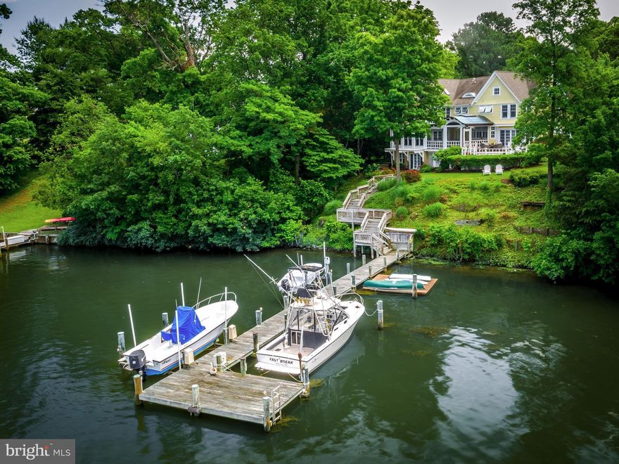 Spectacular waterfront home in coveted Ulmstead updated from top to bottom by Lynbrook builders.  Wide open main level will make you feel like you are on vacation everyday!  Community boasts two marinas, swimming pool, tennis courts, and community center. This is waterfront living at its absolute finest. Pier has boat lift which conveys.