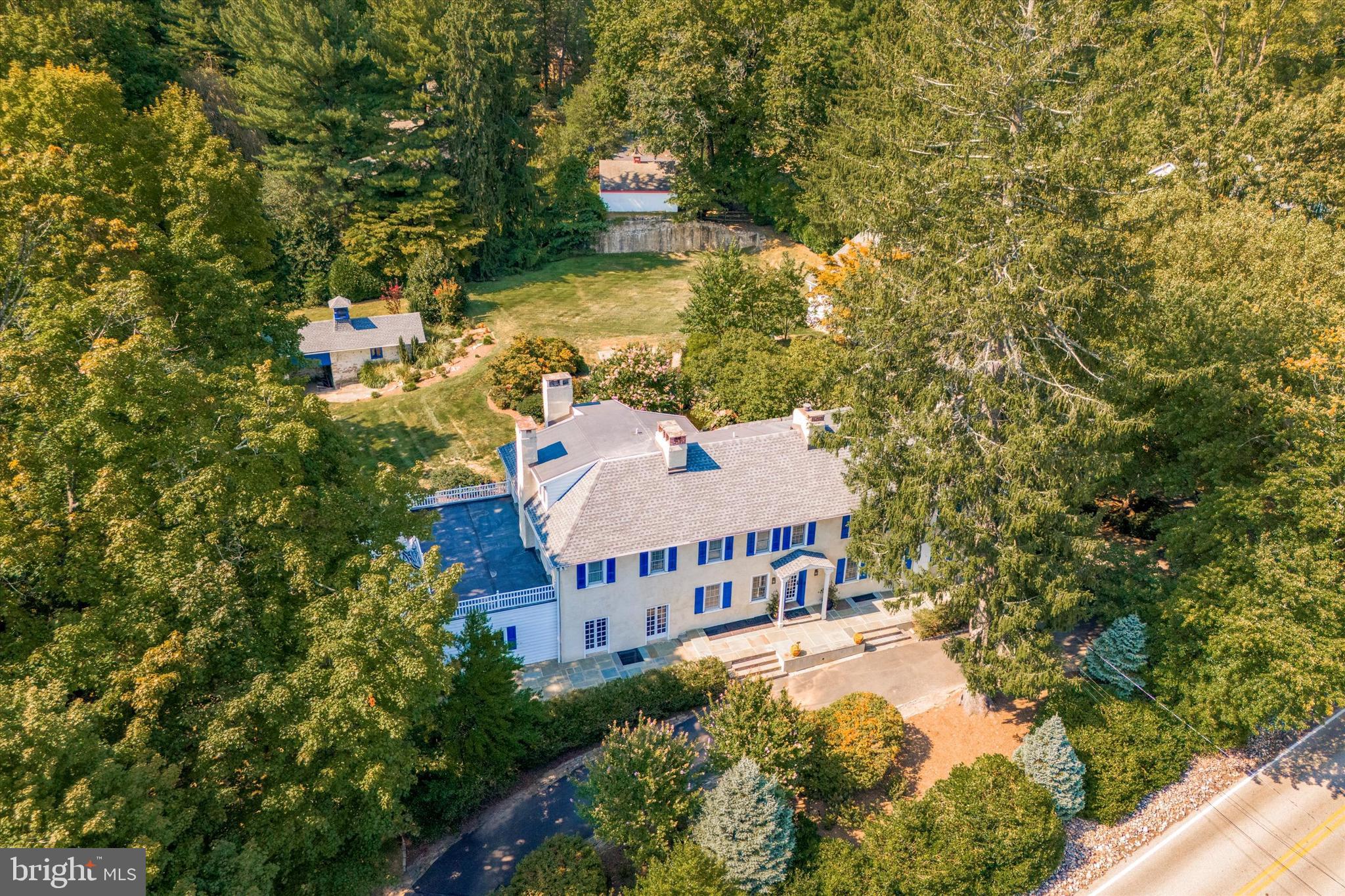 Stately 1700's Farmhouse on nearly 1 acre of gorgeous grounds in beautiful Huntingdon Valley! Enter the impressive property through the circular driveway and imagine coming home to this peaceful place every day. Inside the front door is a spacious entry room with pine planked floor, wood burning fireplace. To the right is a wing leading to the living room/library with fireplace surrounded by built in book shelves and an outside entrance to the back patio. Beyond the living room is the laundry room and a second kitchen. This wing could easily be converted to a main floor in-law suite or nanny quarters. Back to the main entry room and head into the massive dining room with it's gorgeous crystal chandelier, fireplace with wood stove insert, leaded glass built in cabinets, adjacent butlers pantry and French Doors leading to the front porch. Next is the enormous great room/ kitchen/solarium with two walls of huge windows providing great natural light and gorgeous views of the property with access to the patio and grounds. The updated kitchen with island, includes newer cabinetry with granite countertops, tile backsplash, all stainless steel appliances including a large built-in Kitchen-Aid refrigerator, island cook top, fireplace and a solarium section to accommodate all your house plants.
Upstairs is the large main suite with it's own balcony and bathroom with double sink, jetted tub, large shower stall, heated towel rack and a walk in closet. The 2nd bedroom has it's own bathroom with a walk in shower stall and a generously sized closet. There is an additional bedroom on this level with French doors leading to another balcony. Completing this level is a 4th bedroom which has been used as a dressing room with 3 closets and another full bath. The third floor includes 2 bedrooms and a full bath with tub/shower.
Wander outside along the beautiful flagstone walkway through the extensive landscaping and experience the serene setting as you pass the sweet pond with waterfall to the picturesque stone spring house and the large open completely fenced yard which would be a great place for an inground pool or tennis court. The 3 car oversized detached garage includes a 2nd level which would be great for an office, art studio or craft room. This unique well maintained property is located in a top rated school district with easy access to everything.
The property is being sold "as is" and the seller will not do any repairs. Seller has never lived there so makes no representations or warranties.