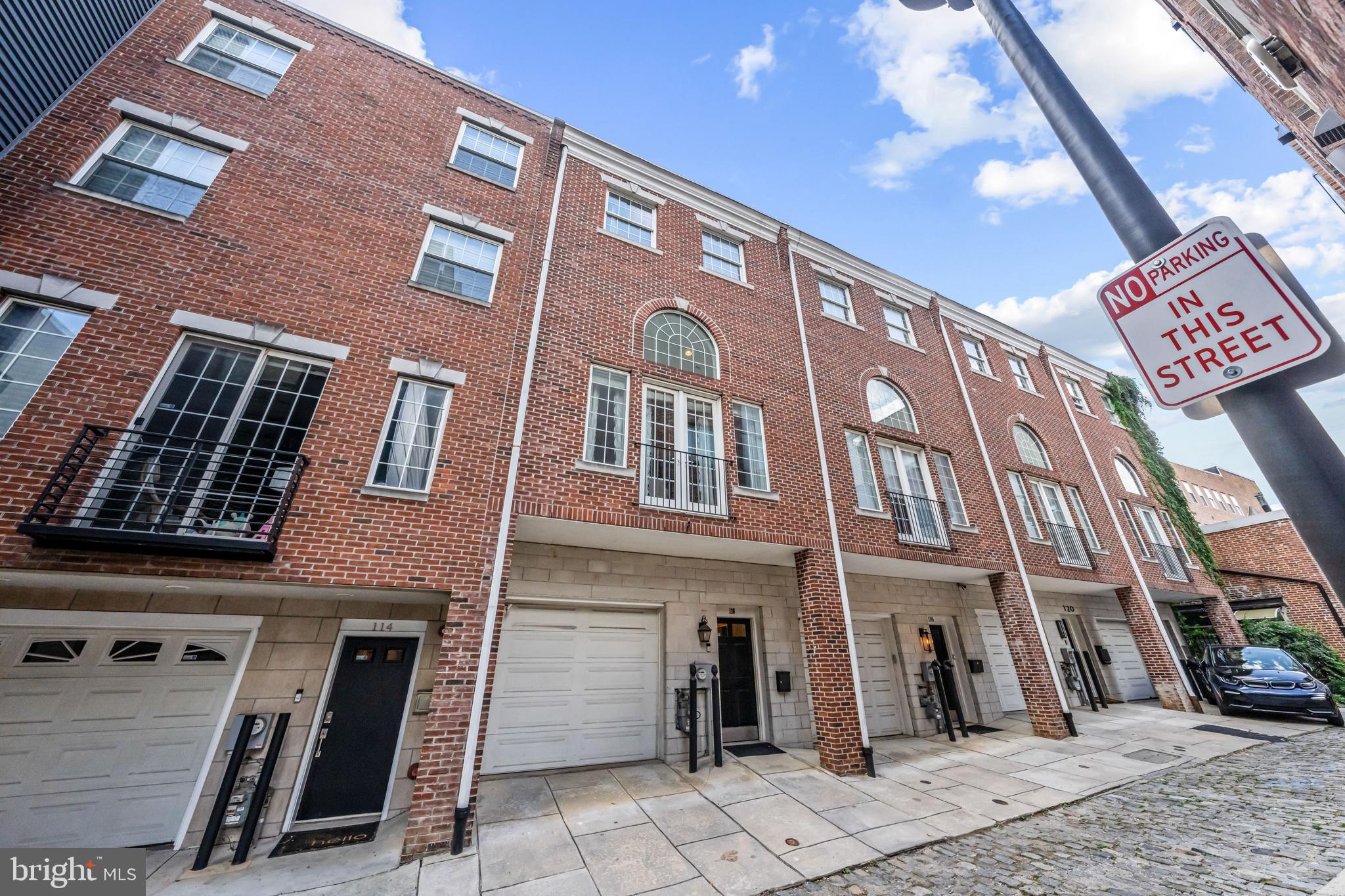 Tucked away on one of Old City’s most picturesque cobblestone streets, 116 Quarry Street offers the rare combination of historic character and modern convenience. This spacious four-bedroom, two-and-a-half bath residence with garage parking delivers nearly 2,800 square feet of contemporary living space in the heart of Philadelphia’s most vibrant neighborhood. Inside, tall ceilings and oversized windows bring natural light into every level. The main floor is designed for both everyday living and entertaining, anchored by a chef’s kitchen with a generous center island, granite counters, and stainless steel appliances, including a Sub-Zero refrigerator. The open concept layout flows seamlessly into the dining and living areas, with a dual-sided fireplace adding warmth and style. Just beyond, a private deck offers the perfect spot for morning coffee or evening gatherings. Upstairs, the primary suite provides a peaceful retreat with a walk-in closet and spa-like bath with frameless glass shower and double vanity. An additional bedroom on the same level adds flexibility for family, guests, or office space. Two more bedrooms and a full bath complete the home’s thoughtful layout, while the lower-level laundry room adds convenience. At the top, a private office nook opens to a spectacular roof deck showcasing sweeping 360-degree views of the Ben Franklin Bridge, city skyline, and beyond. It’s an unmatched vantage point for sunsets, fireworks, or summer entertaining. With its wide and deep proportions, attached garage, and absence of association fees, this residence lives like a suburban home while placing you just steps from Elfreth’s Alley, award-winning McCall School, and the endless dining, cultural, and waterfront attractions of Old City. 116 Quarry Street is a rare opportunity to enjoy space, parking, and views in one of Philadelphia’s most sought-after historic settings.