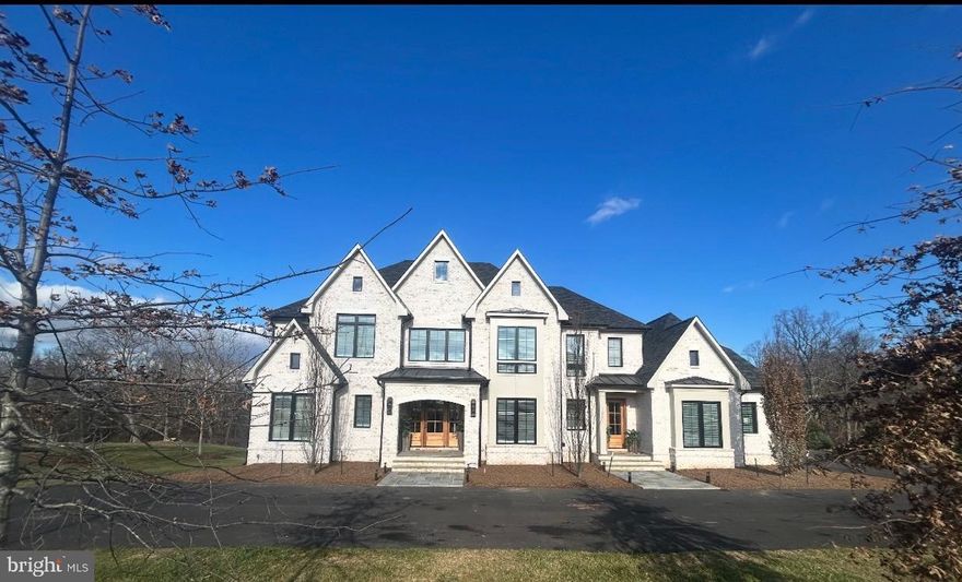 Stunning custom-built Carrington Home offering over 10,000 sq. ft. across three finished levels, combining exceptional craftsmanship, advanced technology, and refined design. Set on a beautiful homesite in Middleburg, this 2x6 constructed residence features wide-plank hardwood floors throughout the main and upper levels, 8-ft interior doors, and ceiling heights of 10 ft on the main level and 9 ft on both the upper and lower levels.

The main-level primary suite includes a private sitting room with fireplace, custom walk-in closet with built-ins, and a spa-style bath with dual sinks, an oversized walk-in shower with benches, and elegant finishes.

A second primary suite on the upper-level offers a private sitting room, three large walk-in closets with built-ins, vaulted ceilings, a spacious spa bath with separate his-and-her toilet rooms, dual vanities with tower storage, an extra-large shower with benches, and a soaking tub. Three additional en-suite bedrooms feature generous walk-in closets; two include showers with benches and one includes a tub/shower.

The gourmet kitchen features a Wolf wall steam oven, Wolf warming drawer, 36" Sub-Zero column refrigerator and freezer, 24" Sub-Zero wine column, under-counter beverage center, and hardwood flooring. The home is wired with ceiling speakers throughout and includes Comcast high-speed internet.

The partially finished lower-level features matching wide-plank–style LVT flooring, 9-ft ceilings, and flexible spaces for recreation, fitness, along with future customization. A 5-ft fire-rated Liberty safe also conveys.

The Guardian security system includes whole-house water shutoff with sensors, 8 exterior recording cameras, an IP/cloud system, and a wall-mounted interface for control. Mechanical systems include high-efficiency Trane HVAC units with fresh-air replacement and air scrubbers, tankless hot water heaters, a 1,000-gallon propane tank (Valley Energy auto-fill), and wiring for a whole-house generator. Garages include two mini-split systems for climate control and two 240V EV charging receptacles.

The home is served by a 55 gpm well and a 5-bedroom-rated septic with double-tank system, with an Architectural shingle roof for peace of mind. Oversized circular driveway (approx. 20 ft wide) includes a second asphalt top coat scheduled at the 10-month builder follow-up, which also includes drywall touch-ups. First-year builder warranty and a paid HVAC service plan through 2026 are included.

Additional features include Climate-controlled garages, wide-plank wood floors throughout, built-in closet systems, ceiling LED lighting in all bedrooms, and chandeliers in the upper-level primary suite and bath. All three levels offer functional, flexible layouts and high-end finishes.

This newly built Middleburg home offers luxury, advanced home systems, and thoughtful design throughout—ready for immediate enjoyment.