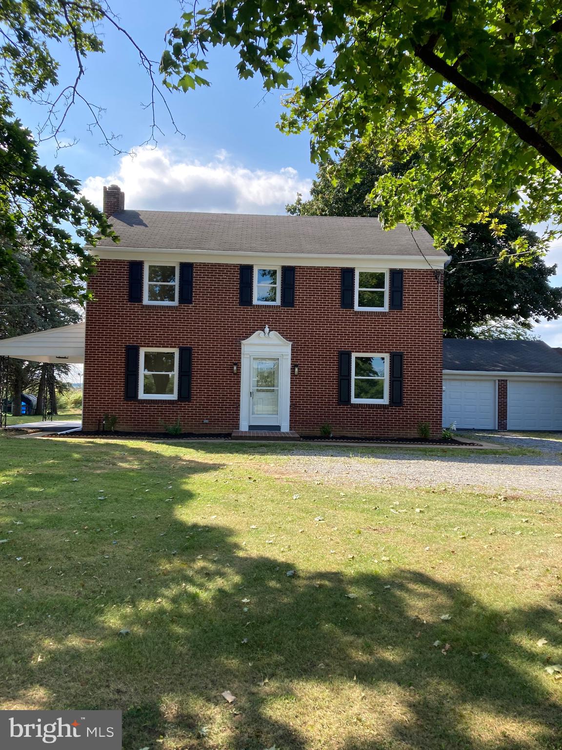 This three bedroom, Colonial-style residence offers a harmonious blend of timeless elegance and modern luxury. With its classic brick exterior and rich hardwood flooring, this home is a true sanctuary for those who appreciate the finer things in life. The heart of this home features a cozy yet grand living space, complete with a stunning brick fireplace that invites warmth and comfort. Imagine evenings spent by the fire, creating cherished memories with loved ones in this inviting atmosphere. The newly remodeled kitchen is a great design that will elevate your cooking experience. The electric oven/range promises precision and efficiency, while the sleek dishwasher and washer/dryer combo ensure that your daily chores are handled with ease. Natural light floods the interior through double-hung, vinyl-clad windows, creating a bright and airy ambiance throughout the home. With a generous lot size of 0.57 acres, the outdoor space offers endless possibilities for relaxation and entertainment. Whether you envision a serene garden retreat or an outdoor gathering space, the expansive yard provides the perfect canvas for your dreams. The attached garage ensures that your vehicles are protected while adding to the home's overall convenience. The great location puts you just moments away from vibrant community amenities. Indulge in the luxury of this remarkable residence, where every feature has been designed to enhance your everyday life. Don't miss the opportunity to make this property your own and embrace a lifestyle of comfort.