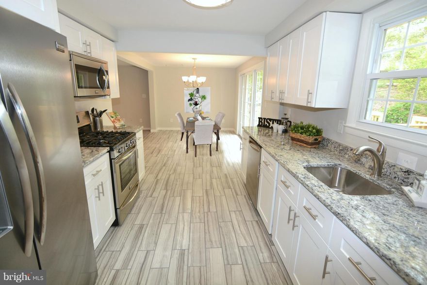 FABULOUS RENOVATION! Nice colonial in GREAT location!! 4 bdrm, 1 full bath, 2 half baths. EVERYTHING NEW, HVAC, CUSTOM KITCHEN AND BATHS, NEW DECK, REC RM AND ADDITIONAL BDRM IN BASEMENT. CUSTOM TILE IN BATHS. GRANITE COUNTER TOPS, STAINLESS APPLIANCES...NO EXPENSE SPARED!! I AM GORGEOUS!!! CALL Heidi TODAY for a showing!