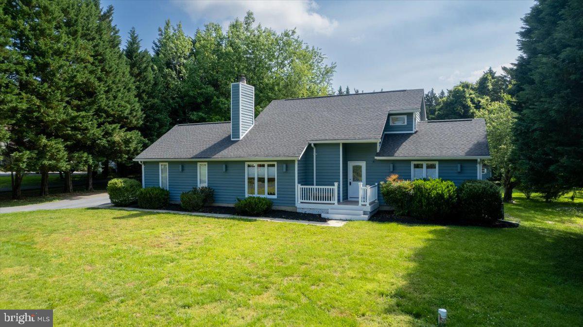 Welcome to your dream home nestled in the highly sought-after community of Gingerville Woods. This beautiful contemporary residence offers the perfect blend of modern living and timeless elegance. With four bedrooms and three baths, this move-in ready gem is designed to meet all your family's needs. As you enter the main floor, you'll be greeted by a living room adorned with a cozy fireplace, creating the perfect ambiance for gathering with loved ones. The dining room and kitchen flow seamlessly together, providing a seamless space for entertaining and culinary delights. Prepare to be bathed in natural light as large windows throughout the home invite the warmth of the sun into every room. The living room boasts built-in cabinets, adding a touch of sophistication and practicality. But that's just the beginning! Step out onto the gorgeous deck, accessible from both the dining room and the primary bedroom suite. Imagine lazy afternoons spent lounging in the screened-in porch, savoring the fresh air and indulging in Maryland's famous steamed crabs. For ultimate relaxation, unwind in the hot tub conveniently located right on the deck, allowing you to escape the stresses of the day in the comfort of your own home. Venturing to the upper level, you'll find two additional bedrooms and another full bath, providing ample space for family and guests. The lower level offers even more versatility with a recreational room, a fourth bedroom, and another full bath. On this level, you'll also discover the laundry area, making household chores a breeze. As you step through the door, you'll immediately feel a sense of belonging. The meticulous attention to detail and thoughtful design make this house a true home. Situated on nearly an acre lot, the property offers ample space for privacy and outdoor enjoyment. Prepare to be captivated by the beautifully landscaped yard, an enchanting retreat awaiting your presence. Picture yourself spending countless days basking in the sun, surrounded by nature's beauty, and creating lasting memories with friends and family. Don't miss the opportunity to make this stunning contemporary home in Gingerville Woods your own. Experience the perfect blend of luxury, comfort, and natural beauty. YOUR DREAM HOME AWAITS!