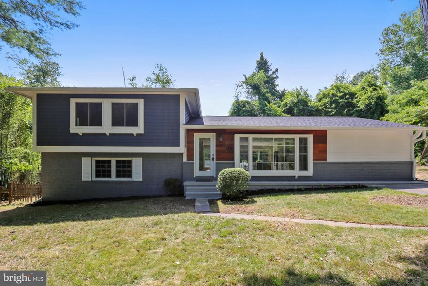 Exceptional! Tastefully renovated gorgeous home in sought-after Cabin John with 4 bedroom 3.5 bath situated on a nice size lot.  Sunlit and open floor plan with two master suites.  Newly renovated kitchen with 42" cabinet, quartz countertop, large island with breakfast bar, and brand new stainless steel appliances.  Beautiful hardwood flooring throughout the main and upper levels. The main level Master suite features a spa-like master bathroom, a stand-alone soaking tub, stylish double sink vanity and a separate shower.  Decorative dining area with sliding door opening to the back deck.  Spacious walk-out lower level family room with natural light, half bath and a lot of storage space.  The upper level features another master suite, two guest bedrooms and a hall bathroom.  Brand new roof and siding with modern accents. Fantastic location where you can walk to restaurants, grocery store, cleaners, post office, C&O canal, Glen Echo Park and the Potomac river.  Mins to VA and easy access to DC and I270.  Short commute to Bethesda and Friendship Heights Metro.  Must see!   SHORT-TERM RENTAL available up to June 2026.