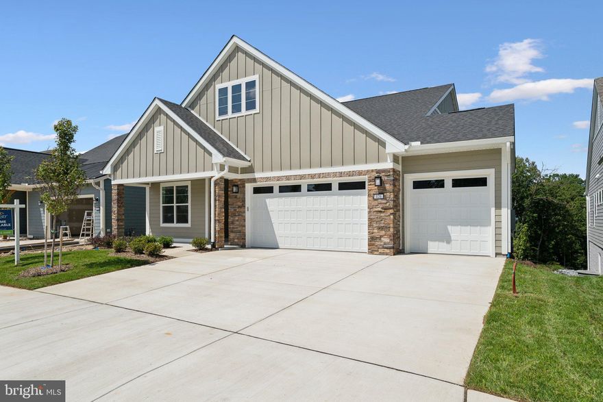 Welcome home to Trilogy at Lake Frederick, the area's premier 55+ community featuring amazing amenities including an expansive recreation facility with indoor and outdoor pools plus the Shenandoah Lodge with dining, drinks, a private lounge, and much more.

This Nice model home offers two finished levels with 3 beds, 3 baths, a 3-car garage, and a walk-out lower level for over 3,400 finished sqft of living space and even more for unfinished storage. You'll relax in privacy on this premium lot ($65,000) with an irrigation system and you'll be thrilled with the luxuries that come with over $335,000 in builder upgrades and options. This home has it all! Engineered hardwood throughout the main level is perfect for easy maintenance and great with pets. Quartz counters add that perfect finish to Shea's Signature Kitchen design with ceiling-height cabinets and an upgraded appliance package. Just outside through the multi-slide stacking doors to the covered rear patio you can cozy up to the gas fireplace and enjoy the cool nights and beautiful fall season ahead. Get ready to fall for this turnkey home with everything done and ready for you!

This is the 55+ community you've been searching to find with incredible amenities that will keep you excited to enjoy every season. Explore the expansive Shenandoah Lodge with its farm-to-table restaurant Region's 117, ballroom for events, Crow's Nest club for members-only, arts & crafts room, culinary experience room, and so much more. Next door there's even more with the recreation facility featuring an indoor and outdoor pool, exercise equipment, pickleball courts, tennis courts, and the list goes on.

Ask about Shea Mortgage's closing cost assistance up to $15,000. Discover your new home, new adventure, and new Active Adult community in Trilogy at Lake Frederick!