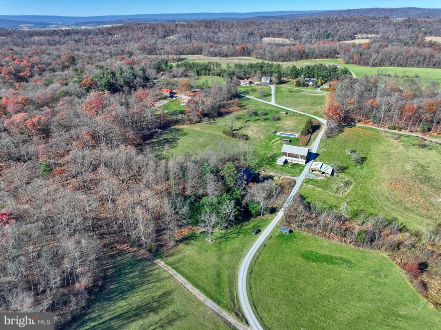 An intimate community of 9 homes in a beautiful country setting. 8 friendly neighbors are ready to welcome the 9th neighbor. What makes this community so special is that the homeowner's association owns 125 acres for everyone to enjoy. This last 1.7 acre wooded homesite offers gorgeous views. As a resident of the Greening Life, the 125 acres is split into two sections: 25 acres of land including orchards, gardens, fenced fields, barn, shed, firepit and an inground pool. 100 acres of wooded land is owned by Greening Life Community where homeowners can hunt or workout by using the trails for walking, hiking, biking and more. Do you have a vision for the home you want to build? Need help with the first step? Call today to set an appointment for more information or to schedule your own private tour. If you are looking for land, privacy and a sense of community, this is the unicorn you do not want to miss!