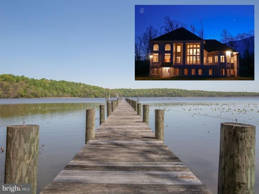 This stunning, custom-built 7 bedroom/7.5 bathroom waterfront home with 4862 sqft and a fully finished 3200 sqft walkout basement embodies elegance and luxury in harmony with beautiful, natural waterfront views of the Potomac Creek, your 300-foot dock, and the historic Crows Nest and Heron Rookery. The home features a full kitchen on the main level and in the basement, and a primary suite on the main level as well as the basement.  Your walkout basement is complete with a luxurious kitchen, primary suite and full bathroom, with two additional bedrooms and a bathroom. Stunning Class 5 Italian tile flooring, heated flooring in the kitchen and primary suites full bathroom, gorgeous 3-sided gas fireplace, wet bar, recessed lighting, and a plethora of natural lighting from the many windows in the basement makes this home ideal for hosting large family gatherings with its ample space.  Your private dock resides on the Potomac Creek that feeds into the Potomac River. With quick access to local Marinas like the Belle Plains Boat Club and Hope Springs Marinas, you are in a centralized location. Surrounding creek area is 6 feet deep with a mean depth of 2.5 feet around your dock.   Through the front door, the 20+ ft ceiling of the great room and its many windows captivate you with its panoramic waterfront views. Elegant Travertine flooring leads you throughout the main level.  Your main level primary suite is ripe with gorgeous waterfront views, with its dedicated sitting area that overlooks your waterfront property and has access to your veranda. The main level primary suite includes two luxurious full bathrooms and two spacious walk-in closets.   Connecting the primary bedroom to the great room is an area perfect for an office or library with more great views of the Potomac Creek and a two-sided fireplace that is shared with the great room.  Along with great views and thoughtfully luxurious upgrades, this home perfectly displays an open floor concept. Walking towards the kitchen from the great room, you will see just how the large archways separate the kitchen, wet bar, dining area, and living room while remaining true to the open floor plan concept.   This gourmet kitchen is a chefs best friend with all the counter space you could want, including a large central island that has a five-burner electric stovetop and retractable range hood, as well as space for seating. The kitchen island seating makes this an ideal place for entertaining while you cook or where the kids can do homework while dinner is being made. Stainless steel appliances showcased in the kitchen include a double wall oven and dishwasher, with a large Samsung refrigerator with French doors. A hallway that leads to a two-car garage, full bathroom, and stairs to the basement, as well as two pantries. Wet bar off kitchen allows you to make your craft cocktails or enjoy a coffee station.  The living room off kitchen/dining, with its two-story ceiling, has many windows to enjoy the gorgeous views or your gas fireplace. The living room and dining area allow for quick access to the veranda that overlooks your backyard and waterfront views. With just how spacious the veranda is, you can grill and enjoy your meal outside, with plenty of room for tables or outdoor furniture for enjoying the weather.  Hardwood flooring and sculptured metal railings invite you to the elegant turned staircase that leads you to the balcony overlook and loft. The captains loft is a great location for an office or a tv area off the upper bedrooms. 2 full bathrooms are upstairs that support 3 bedrooms.  This home has everything you want and need while remaining meticulously maintained, from the visuals to the systems servicing the home. 8 propane tanks, 100 gallons each, leased through AmeriGas. Here are just a few of the key upgrades: roof and gutters with gutter guards 2020, whole-home generator 2011, heat pump 2019, carpet and paint 2021, water heater 2018, water pressure tank 2018.
