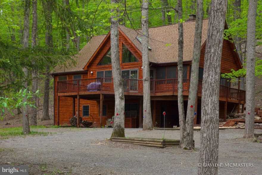 Designer worthy renovated cedar home. AMAZED it hasn't sold.NOW $25K price reduction! It is beautiful. Gorgeous soaring windows, big decks, vaulted wood ceiling and a great new kitchen - all new appliances, granite, new soft close cabinetry. New baths, new HWood ,carpet & ceramic floors-virtually same as new home full of high quality amenities.Pending Release.