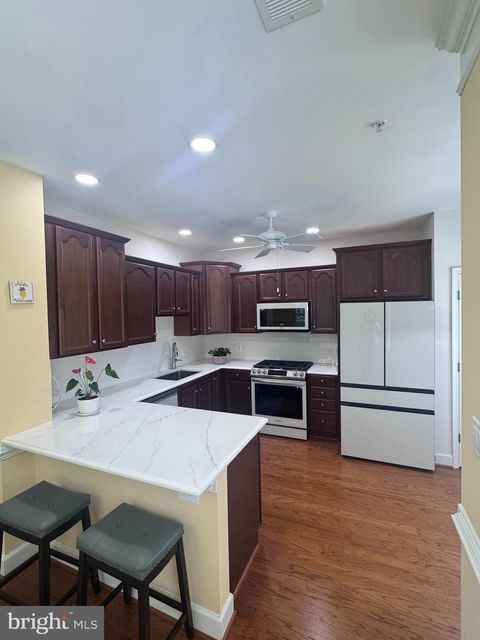 Photo of 7055 Heritage Hunt Drive #111, GAINESVILLE, VA 20155 (MLS # VAPW2124608)