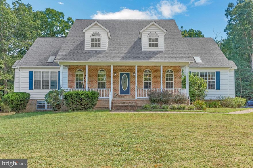 Holy Cape Cod!!!!!!  This home will will WOW you!!!  Offering 4 large bedrooms with 3.5 baths, possible 5th bedroom in the basement, could also be used as a theater room.  Main level offers large open dining room, sittingroom/living room and opens to the large family room with a pellet stove . All NEW hardwood floors throughout the main level!!!!!  The kitchen will stun you with custom cabinets, drapery and wall coverings.  Enjoy entertaining and cooking while family and guest,  gather around the breakfast bar or lounge in the sitting area off the kitchen.  Main level offers large master bedroom with large master closet and jacuzzi tub and separate shower. The upper level offers three large bedrooms with a full bath.  Additional walk in storage with a new AC unit.  The basement will WOW you with a large custom bar all new wood floors with a large storage area and additional bedroom.  Plenty of room in the back yard for a pool in the future if desired.  The deck off the back has a nice covered breezeway.  Large oversized two car garage will make you very happy!!!!!  This lot is very private and offers 3 full areas!!!!