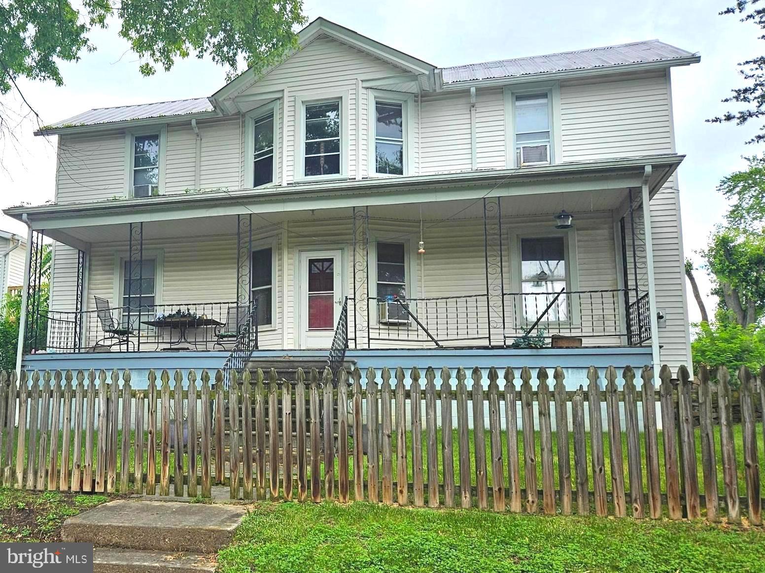 HOME WITH POTENTIAL..... Charming Spacious Victorian very well taken care of, many upgrades but still the charm of yesteryear large 8x35 front porch, beautiful stairway in living room, you will be proud to call this "home sweet home," or "A RENTAL INVESTMENT" RENTALS ARE IN PLACE with reliable good paying tenants, house is currently converted into two apartments, each have two bedrooms, one bath, kitchen, living room, 1st floor apartment has a very large laundry/ mudroom 12x13 sq, both apartments have new kitchens, with quartz counters, microwaves, new flooring, some new windows, new stainless steel appliances, both have updated bathrooms, wood flooring through out, both have washer & dryers, newer ac window units. & ceiling fans, 1st floor apartment has 8x35 covered porch, and top level apartment has a 25x6 enclosed porch.
apartments are separately metered, both apartments are rented, current rental income is $1,550 month, home can easily be converted back to a single family home. minutes to town conveniences, seller requires existing tenants remain in the property for a period of not less than a year following closing date, security deposits & tenant leases convey at settlement. 24 hr notice to show
5eller is offering adjoining property MLS # WVHS2006394 for a combined purchase and 5k in closing cost only when buying both properties together at no less than 385k