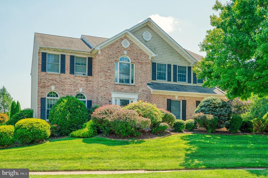 Welcome home! Freshly painted and New Carpet throughout. 4 bedroom 3 1/2 bath brick front colonial, This home offers 9' ceilings, 42" cabinets, trex deck, corner lot, side entry 2 car garage, formal living room & dining room, family room with gas fireplace, master bedroom is huge with super bath, second bedroom has own access to bath ,lower level is finished. with a rec. room, full bath, office or den.