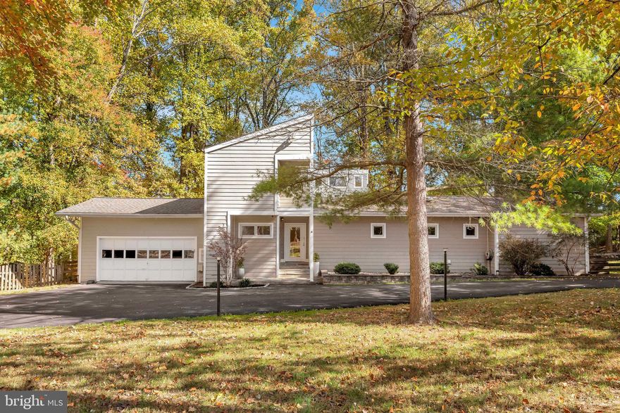 Nestled amidst towering trees, this clean contemporary offers a respite from today's hectic lifestyle.  Once you are inside the fully fenced and gated 1.88 acres property, you'll feel like you've stepped a world away.  Large windows throughout the home bring nature in while the expansive decks allow for al fresco dining and the screened porch offers a bug free environment for ultimate relaxation.  Newly refinished floors, along with fresh paint, presents a pleasing backdrop for you to make the 3500 sq. ft., 4 bedroom, 3 bath home your own.  Home has great access to Fraser Preserve with multiple trails to the Potomac River and other nearby regional parks yet also conveniently near to renowned L'Auberge Chez Francoise.