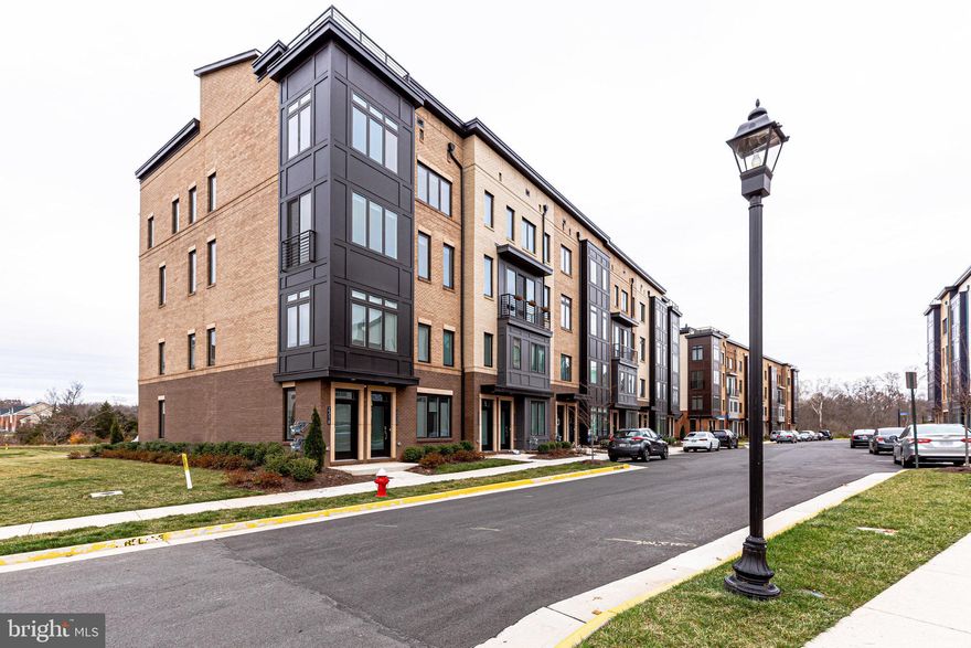 Amazing luxury 2 level three bedroom condominium.  This end unit townhome styled condo comes with a rooftop deck covered porch.  It also includes a bonus room/office along with a one car garage equipped with a tesla charging port.