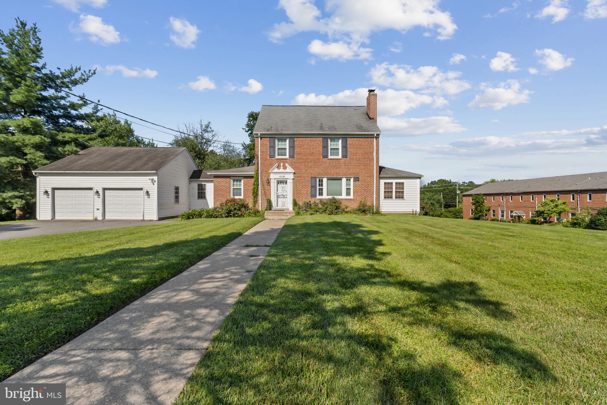 Welcome to this stately brick home offering over 2,900 square feet of living space, set on an expansive lot with a giant front yard and generous backyard—perfect for outdoor enjoyment. With 4 bedrooms, 1 full bath, and 1 half bath, this home combines timeless charm with everyday functionality. Step inside to discover hardwood floors, a spacious country kitchen ideal for gatherings, and a serene enclosed porch with exposed brick—offering a cozy retreat year-round. The oversized two-car garage is connected to the home via a covered breezeway, providing easy interior access in all seasons. There is an additional 1-car garage situated to the back of the home for additional parking and storage. Upstairs, three roomy bedrooms share a well-appointed full bath, while the top-level bedroom features ample closet space—perfect as a private guest suite. The finished lower level offers extra room to spread out along with abundant storage in the laundry and utility areas. Enjoy the large elevated back deck overlooking the expansive backyard—ideal for entertaining or relaxing in nature. Don’t miss this rare rental opportunity that offers space, character, and comfort in a sought-after setting. Apply via RentSpree Link provided in Agent Remarks.