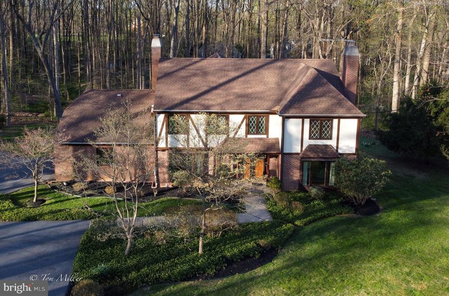 Location, Location, Location!!! You will love coming home to this beautiful Tudor home in the Fallswood neighborhood conveniently located  in the Falls Road Corridor. Situated on a level partially wooded lot with plenty of privacy provides ample space for outdoor recreational activity. Walk through the front door into an open foyer with gleaming marble flooring. This home boasts a spacious floor plan with a large LR & FR both with fireplaces, a formal DR, and a huge open kitchen. The center island is extended with tons of prep and serving space. Also, there's an abundance of Corian counter space and cabinets. It'll be the hub of the home and perfect for entertaining. Upstairs are 4 large bedrooms. The primary and one other bedroom are complete with en suites.  The is also another full bath. The primary features a Jacuzzi tub and separate shower stall. A connecting room can be an additional bedroom or dressing room or an office. It's a bonus space with loads of possibilities! In the LL you will find a large Recreation room complete with wet bar and plenty of storage space. Central sound system & intercoms on all 3 levels. Heating & cooling systems installed in 2001 & 2019. All appliances 2001. Roof 2001. Well pump 2020. Water tank 2021. Central alarm. Don't miss this lovely home!! Make your appointment today!!