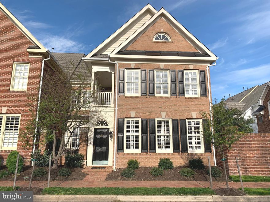 Stately Charleston-Style Home on the outside - exquisitely remodeled with premium features and finishes on the inside.  Enter this amazing home through the private courtyard designed for outdoor dining.Open concept living/dining room with gorgeous new hardwood floors, large windows and plantation shutters provide a wonderful flow for entertaining.  Relax in your sleek family room with linear electric fireplace, built-ins & specialty lighting.  Just a few steps past the elegant powder room, enter the glamorous gourmet kitchen complete with Cambria quartz counters and oversized island, Italian porcelain flooring, custom cabinets and deep drawers, sparkling chandeliers and above and below cabinet lighting.  The adjoining beverage center with glass cabinets, beverage refrigerator, wet-bar sink, and walk-in butler's pantry adds to the ease of entertaining.  The sunny patio off of the kitchen and a two-car garage with built-in cabinets finish off the first level.  Now...take 16 steps to the second floor of this lovely home to the expansive master suite complete with sitting room, beautifully remodeled bath, custom walk-in closet, laundry room and balcony overlooking the courtyard.  Two guest rooms, one with high ceilings and four closets, & one used as an office with a walk-in closet, along with a stunning guest bath complete the interior of this absolutely perfect home.  Walk to King Street Metro, Whole Foods and Old Town's shops and restaurants.  Community salt-water pool, fitness center, events and activities make this a great place to call home!