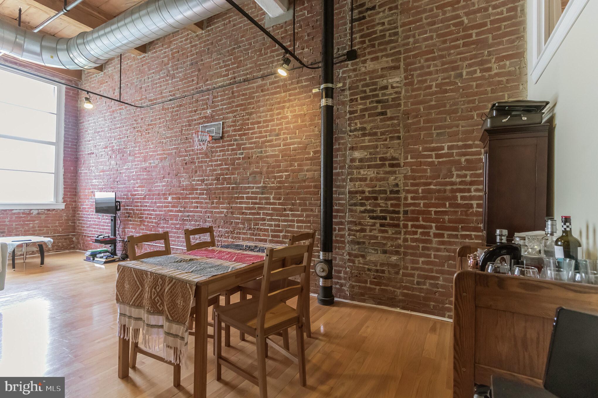 One of a kind TWO TRUE BEDROOM loft style condo with WASHER DRYER. Largest layout with soaring 14 ft ceilings and oversized windows in the heart of center city. Exposed brick, wood beams, central air and heat, stainless appliances, open kitchen layout, spa-tub in bathroom. Concierge front desk from Mondays to Saturdays.If you're tired of cookie cutter styled condos, and you want a place that has truly unique character in a central location, welcome to your new home. Enjoy great restaurants, pubs, live entertainment and shopping. Just a block away from the Reading Terminal Market, the Pennsylvania Convention Center, the largest regional rail hub in Philadelphia, subway, busses, and the Naval Yard Shuttle. You will also be just around the corner from the Fashion District of Philadelphia which will offer 838,000 SF of the best designer brands and artisanal dining experiences. Assessor sq ft may be incorrect