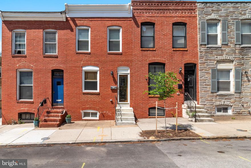 Don’t miss this beautifully updated 2‑bedroom, 2‑bath home located in the heart of Canton. The main level features wood flooring and an inviting living room highlighted by an exposed brick accent wall that flows seamlessly into the kitchen. The kitchen offers tile flooring, granite countertops, stainless steel appliances, and a convenient pantry area.

Also on the main level is a full bathroom with a tiled shower, a dedicated laundry area, and rear access to a private patio just off the one‑car garage, perfect for easy indoor‑outdoor living.

The partially finished lower level, with a lower ceiling height, provides flexible space ideal for a home office, den, or playroom. Upstairs, the spacious primary bedroom impresses with a vaulted ceiling, skylight, and double doors leading to a rear deck, filling the space with natural light. The primary suite also boasts exceptional storage with two closets. The upper‑level full bathroom includes a double‑sink vanity, tile flooring, and a soaking tub with shower.

The second bedroom features its own exposed brick wall, two closets, and a ceiling fan. All of this is set in a prime Canton location, just steps from a wide variety of dining options and minutes from major retailers including Target, Harris Teeter, and BJ’s.